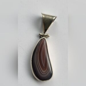 Botswana agate teardrop pendant set in sterling silver.